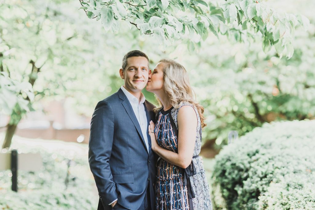 bride kisses groom during engagement session with M Harris Studios