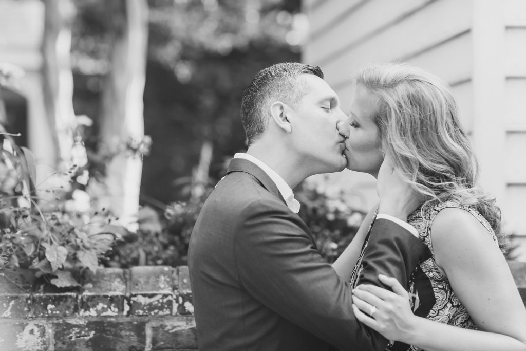 bride and groom kiss during engagement session with M Harris Studios
