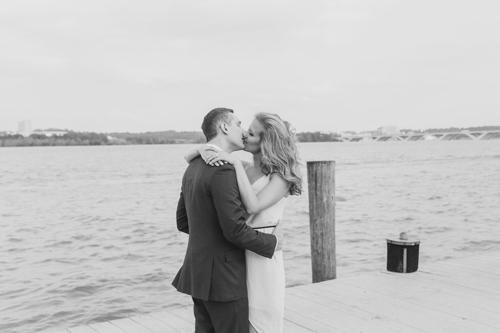 bride and groom on pier photographed by M Harris Studios