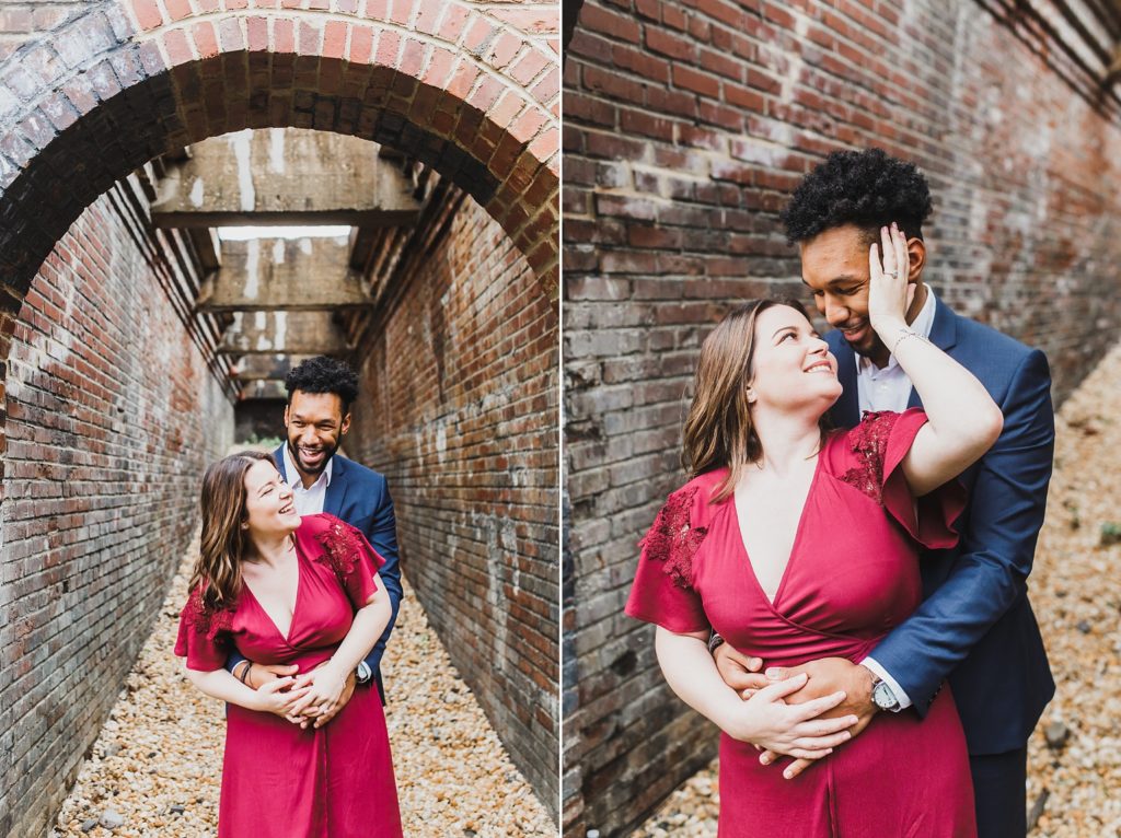 couple among brick for engagement session with M Harris Studios