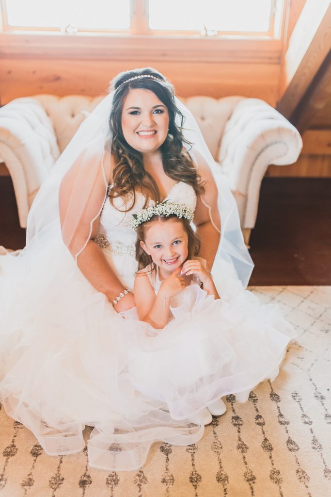 flower girl with bride photographed by M Harris Studios