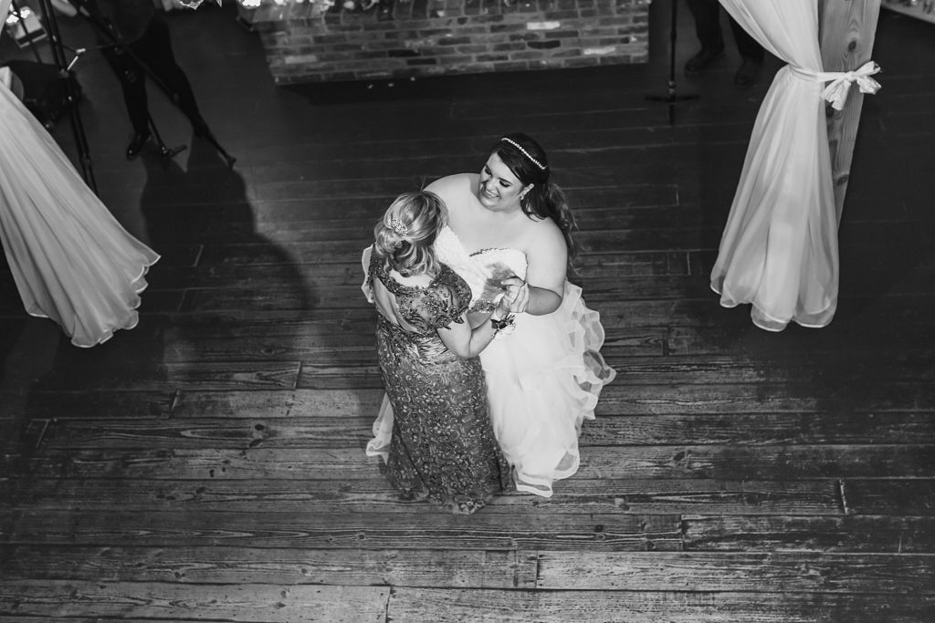 mother and bride dance at wedding reception photographed by M Harris Studios