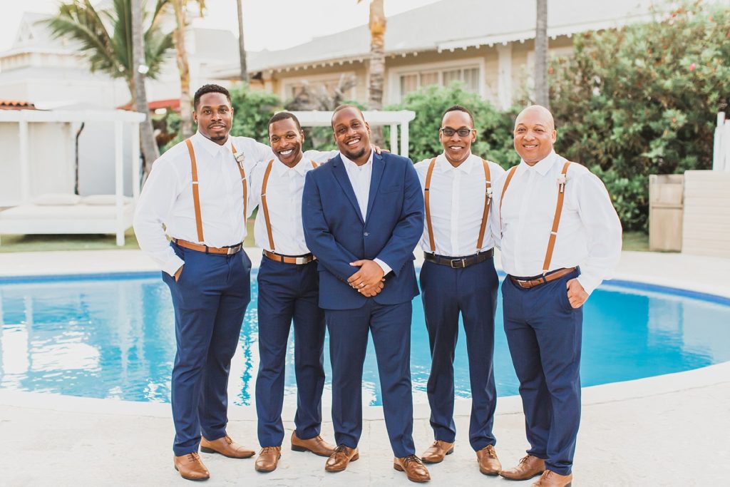 groomsmen portraits by the pool photographed by M Harris Studios