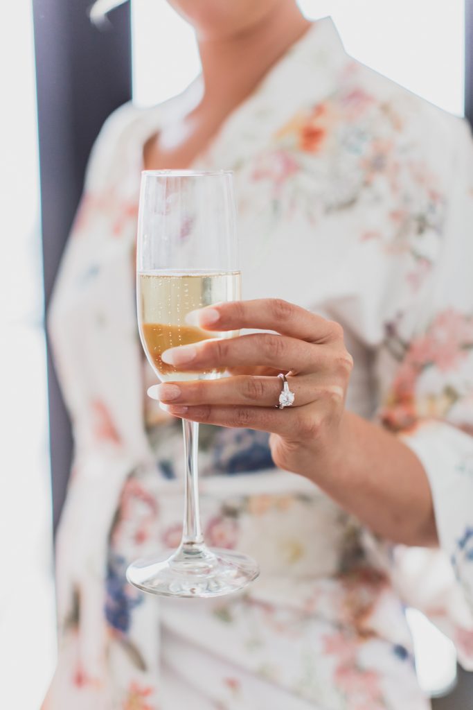 bride toasts wedding day in DC with M Harris Studios